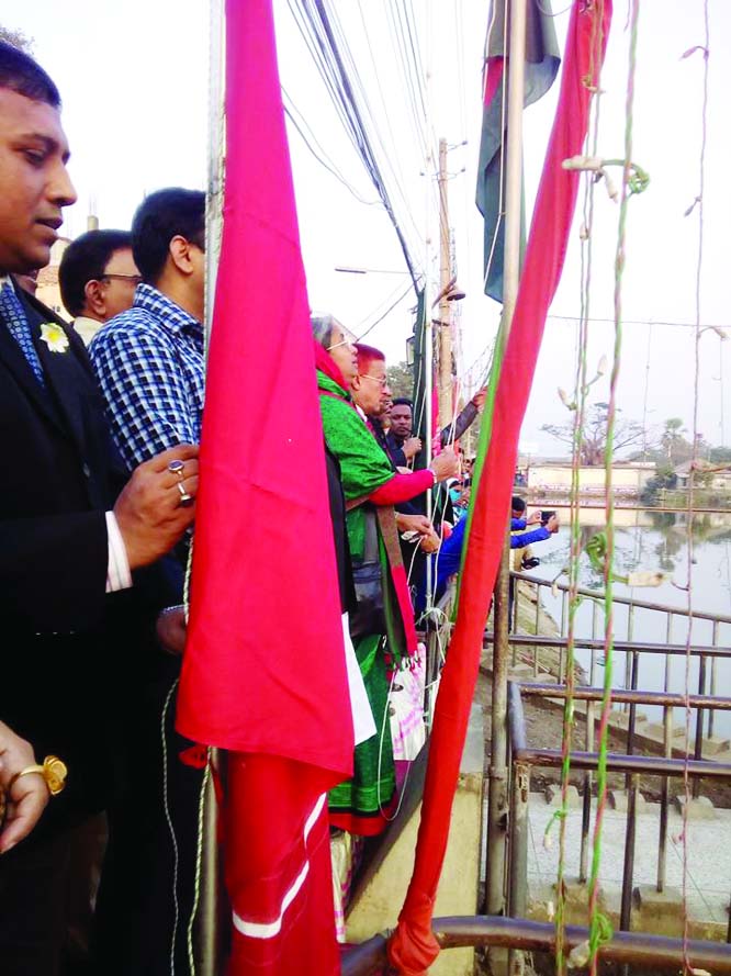 CHANDPUR : Dr Dipu Moni MP inaugurating the month -long 'Muktijuddher Bijoy Mela' by hoisting national flag in front of Ongiker - a memorial monument of 1971, as Chief Guest at Chandpur Hasan Ali High School ground on December 8.