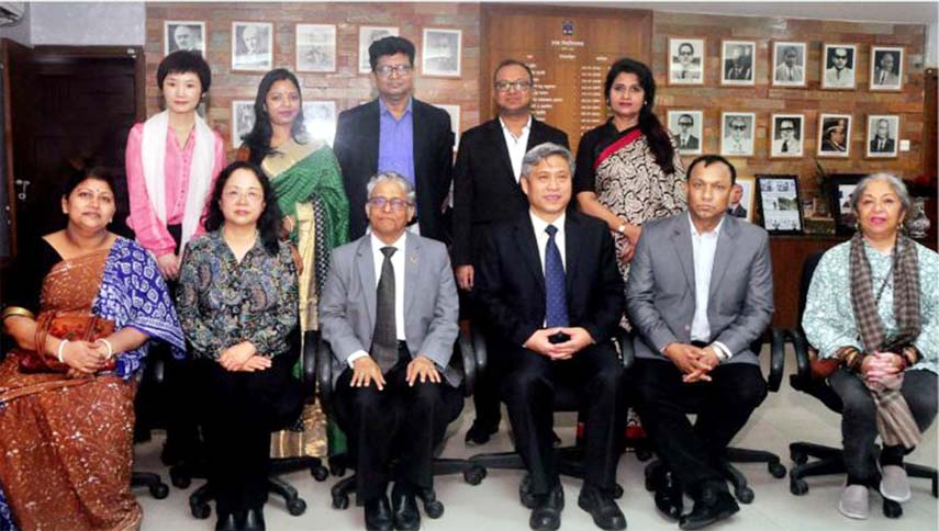 Dhaka University Vice-Chancellor Prof Dr Md. Akhtaruzzaman poses for a photo-shoot with a Chinese delegation led by Prof Jian Hua Miao, Vice-Chairperson of Central Conservatory of Music on Sunday.