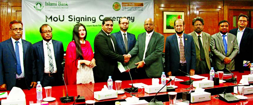In presence of Mohammed Monirul Moula, AMD of Islami Bank Bangladesh Limited, Abu Reza Md. Yeahia, DMD of the Bank and Dr. M. Easin Ali, Chairman of Dhaka City Physiotherapy Hospital, exchanging an agreement signing document at the Banks head office in th