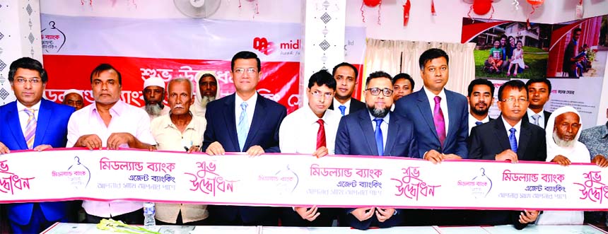 Ahsan-uz Zaman, Managing Director of Midland Bank Limited, inaugurating its an Agent Banking Centre at Guzia Bazar in Shibgonj Sadar Upazila in Bogura on Wednesday. Senior official of the Bank and local elites were also present.