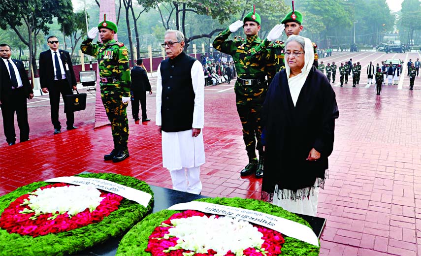 President Abdul Hamid and Prime Minister Sheikh Hasina stood in solemn silence for a while after placing wreaths as mark of respect to memories of the Martyred Intellectuals at Mirpur on Friday.