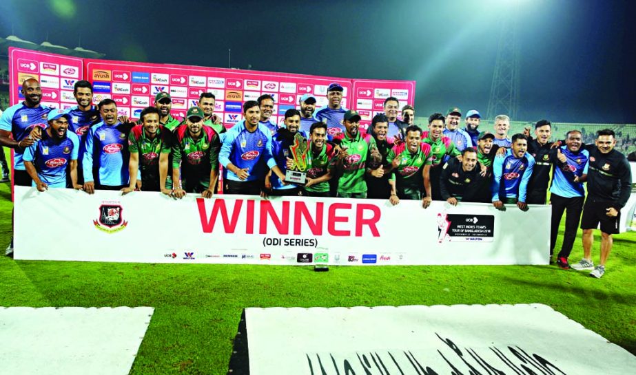 Members of Bangladesh Cricket team pose with the championship trophy after beating West Indies in the three-match ODI series at Sylhet International Cricket Stadium on Friday.