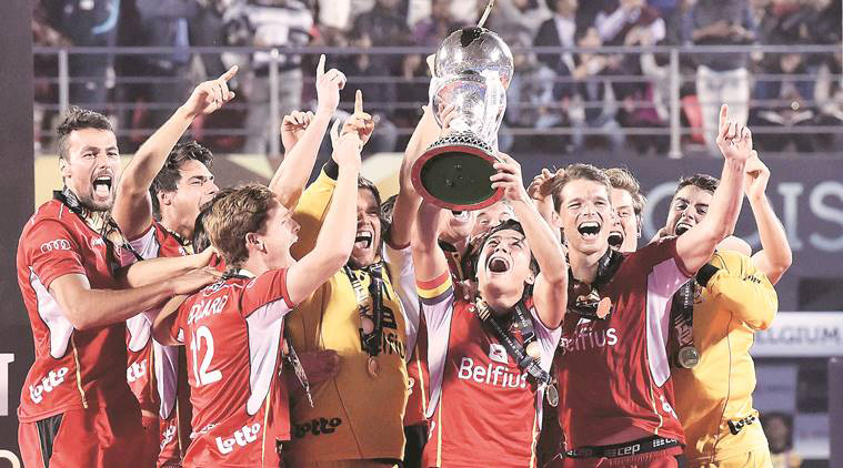Belgian players celebrate with the World Cup hockey trophy after beating the Netherlands in the final in Bhubaneswar on Sunday.