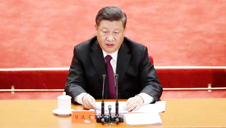 Chinese President Xi Jinping speaks at an event marking the 40th anniversary of China's reform and opening up at the Great Hall of the People in Beijing on Tuesday.