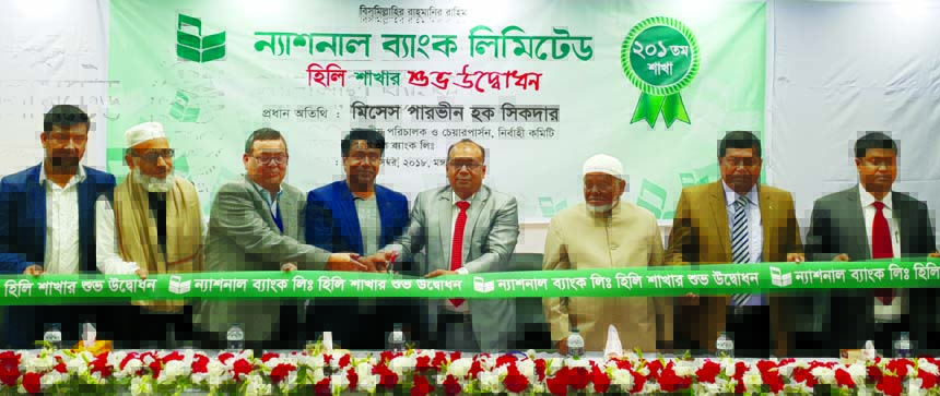 Parveen Haque Sikder, EC Chairperson of National Bank Limited, inaugurating its 201st branch at Hili Land Port on Tuesday. Ali Haider Mortuza, Vice-President, other officials of the Bank, local businessmen and elites were also present.