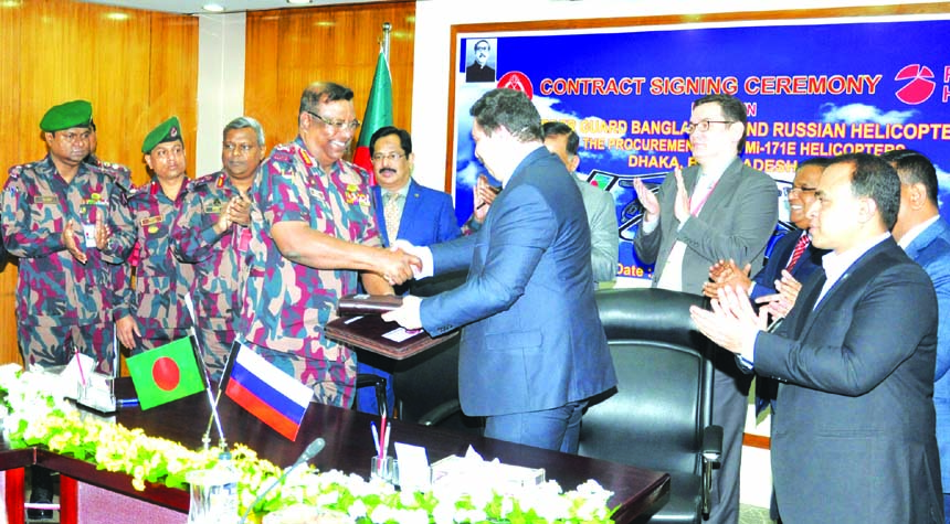 In presence of Home Minister Asaduzzaman Khan Kamal, Director General of Border Guard Bangladesh (BGB) Major General Md. Shafeenul Islam, ndc, and Andrey Furtay, on behalf of JSC Russia Helicopters, exchanging an agreement signing documents to procure two