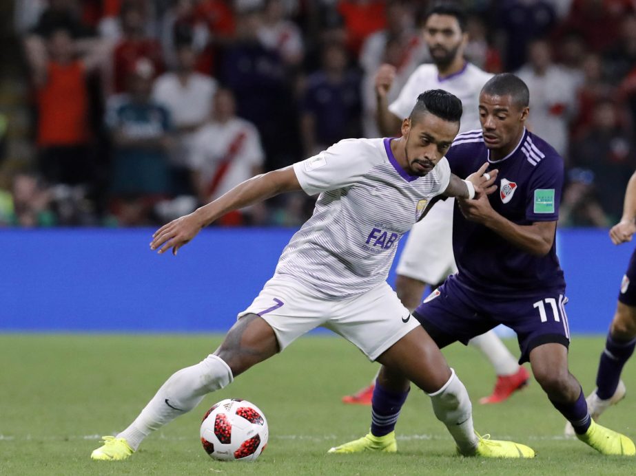 Emirates's Al Ain Caio (left) duels for the ball with Argentina's River Plate Nicolas De La Cruz during the Club World Cup semifinal soccer match between Al Ain Club and River Plate at the Hazza Bin Zayed stadium in Al Ain, United Arab Emirates on Tuesd