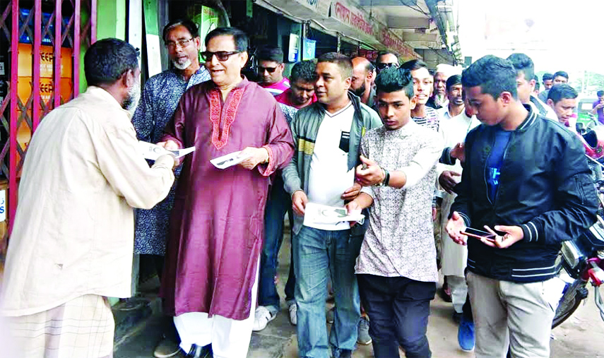 SYLHET: Oikyafront nominated candidate from Sylhet- 3 Seat Alhaj Shofi Ahmed Chowdhury distributing election leaflets at South Surma Upazila on Monday.