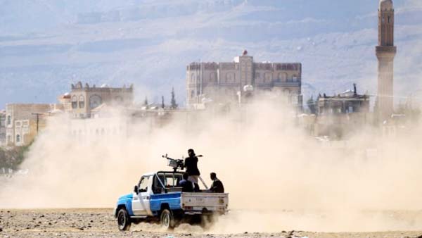 Yemeni men stand on the back of an armed pick-up truck in the rebel-held capital Sanaa on Wednesday Yemeni men stand on the back of an armed pick-up truck in the rebel-held capital Sanaa .