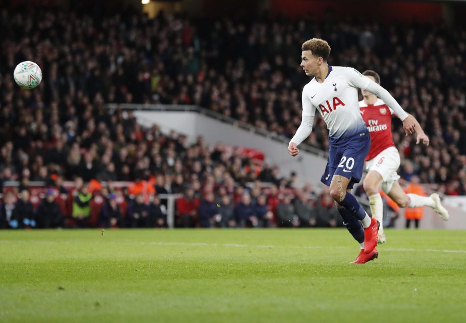 Tottenham's Dele Alli (right) scores his side's second goal during the English League Cup quarter final soccer match between Arsenal and Tottenham Hotspur at the Emirates stadium in London on Wednesday.