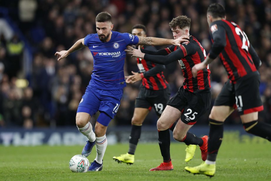 Chelsea's Olivier Giroud (left) holds off Bournemouth's Jack Simpson during a League Cup, quarterfinal soccer match between Chelsea and Bournemouth at the Stamford Bridge Stadium in London on Wednesday.