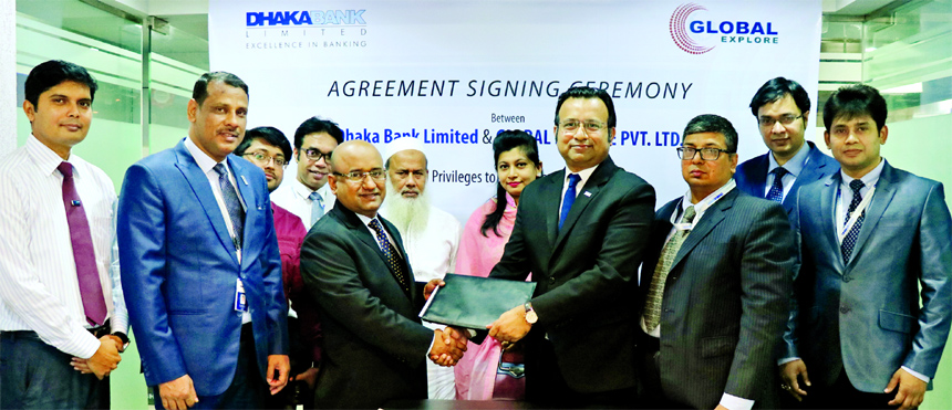 M Mostafizur Rahman, Head of Cards of Dhaka Bank Limited and HM Saif Ali Khan, Managing Director of Global Explore Limited, exchanging a MoU signing document at Global Explore office in the city recently. Under the deal, cardholders of the Bank will get u