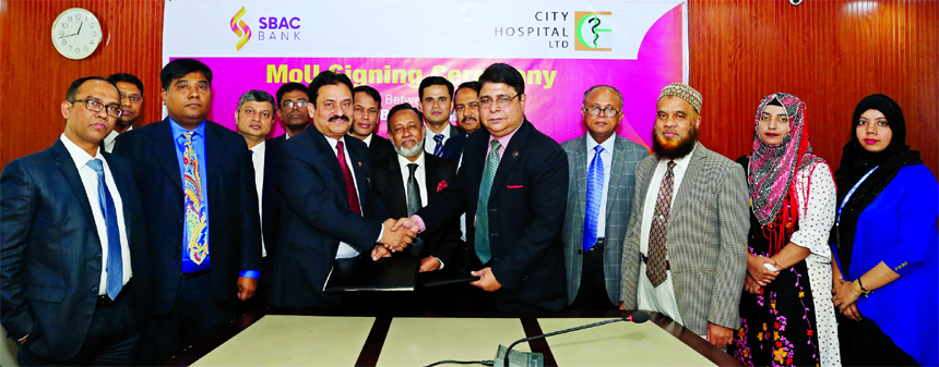 Mostafa Jalal Uddin Ahmed, AMD of South Bangla Agriculture and Commerce (SBAC) Bank Limited and Lt. Col. (Retd.) Dr. Md. Rafiqul Alam, Superintendent of City Hospital Limited, exchanging a MoU signing documents at the Banks head office in the city recentl