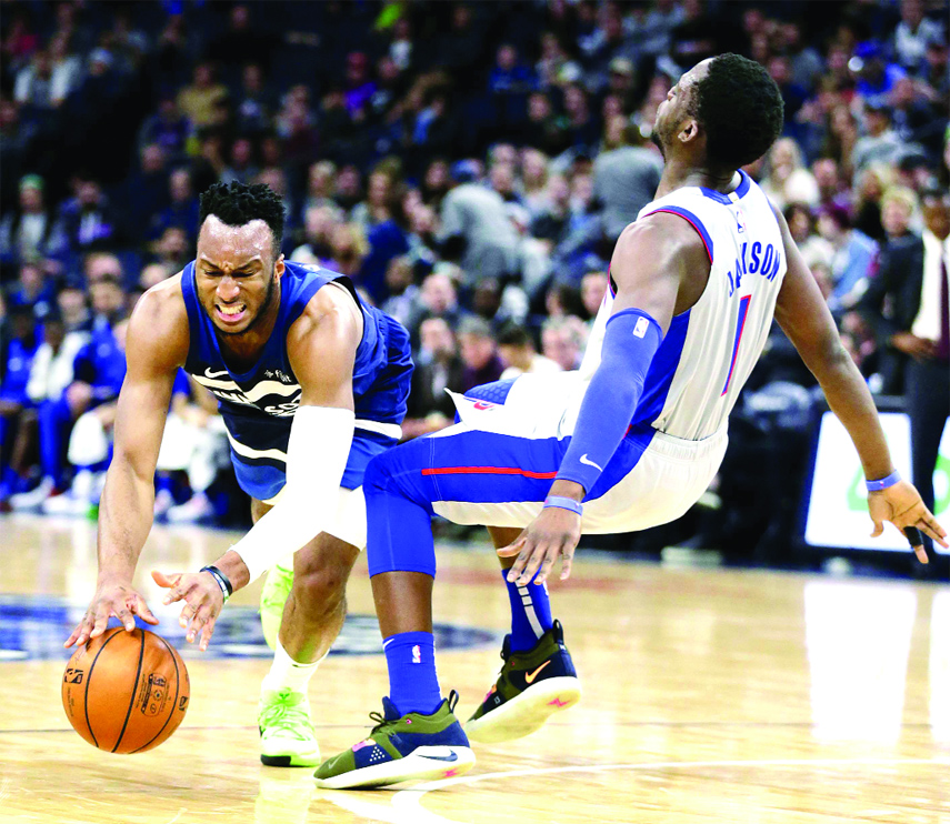Minnesota Timberwolves guard Josh Okogie is fouled by Detroit Pistons guard Reggie Jackson (1) in the second quarter of an NBA basketball game Wednesday.
