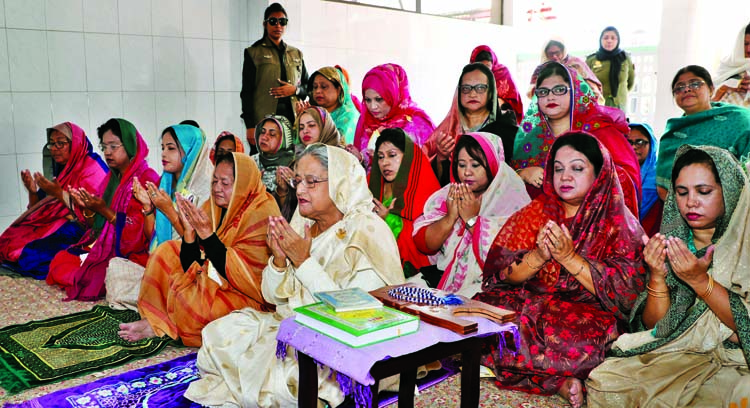 Awami League President and Prime Minister Sheikh Hasina along with others offering munajat after ziarat at the Shrine of Hazrat Shajalal Â® in Sylhet on Saturday. BSS photo