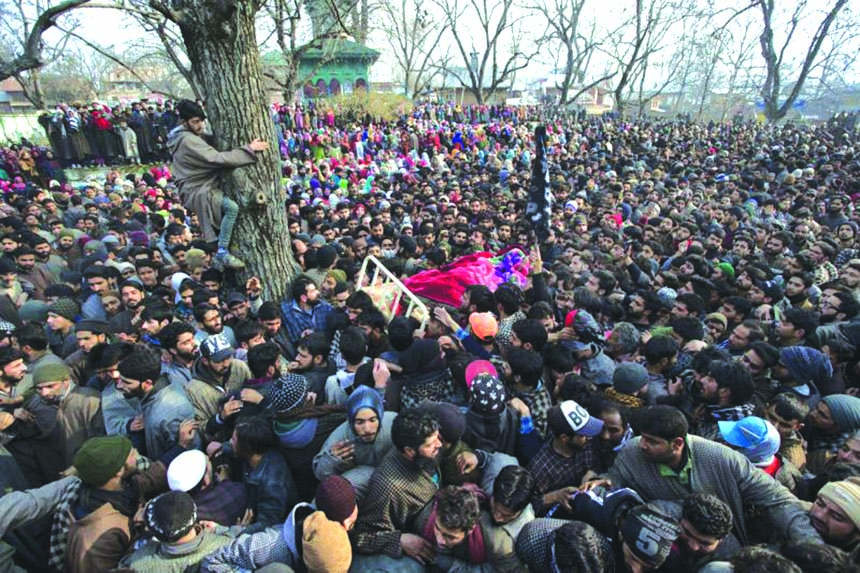 Kashmiri villagers carry the body of Rasik Mir, a local rebel during a joint funeral procession of four rebels in Tral, south of Srinagar, Indian controlled Kashmir on Saturday.