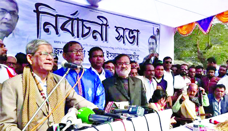 BNP Secretary General Mirza Fakhrul Islam Alamgir addressing a public gathering (not seen) as chief guest at Nilphamari-8 Constituency in favour of party candidate Mohd.Amjad Hossain Sarkar. This photo was taken from Syedpur Railway Colony 5-Star Maidan o