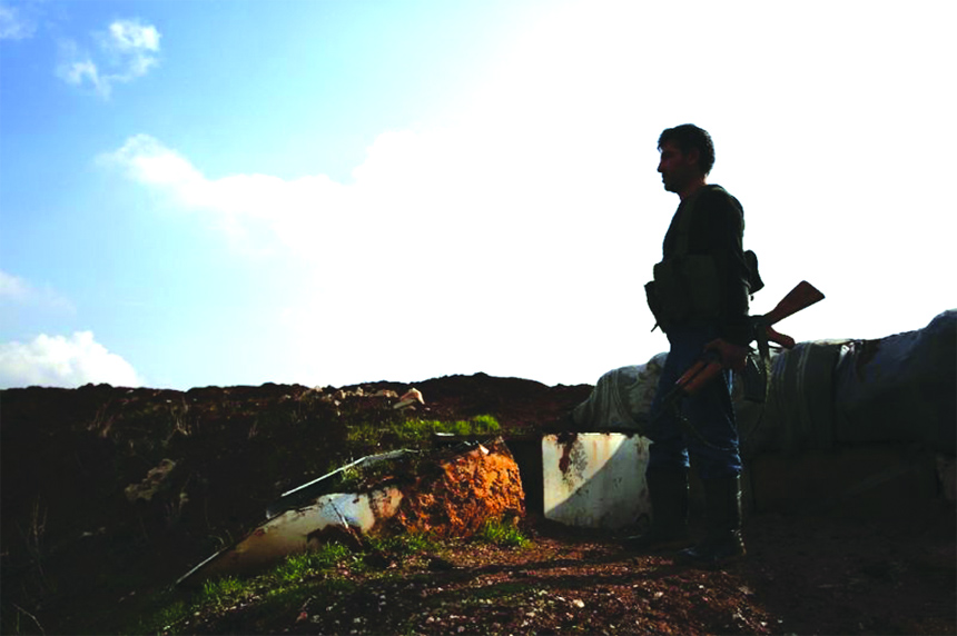 A Turkish-backed Syrian fighter in the village of Tal Malid, in the north of Aleppo province.