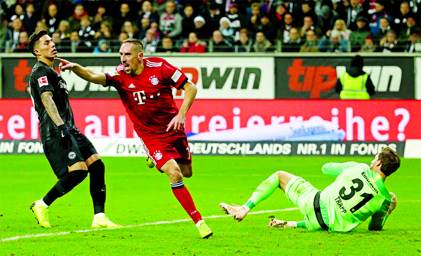 Bayern's Franck Ribery (center) celebrates after scoring the opening goal during the German Bundesliga soccer match between Eintracht Frankfurt and FC Bayern Munich in Frankfurt, Germany on Saturday.