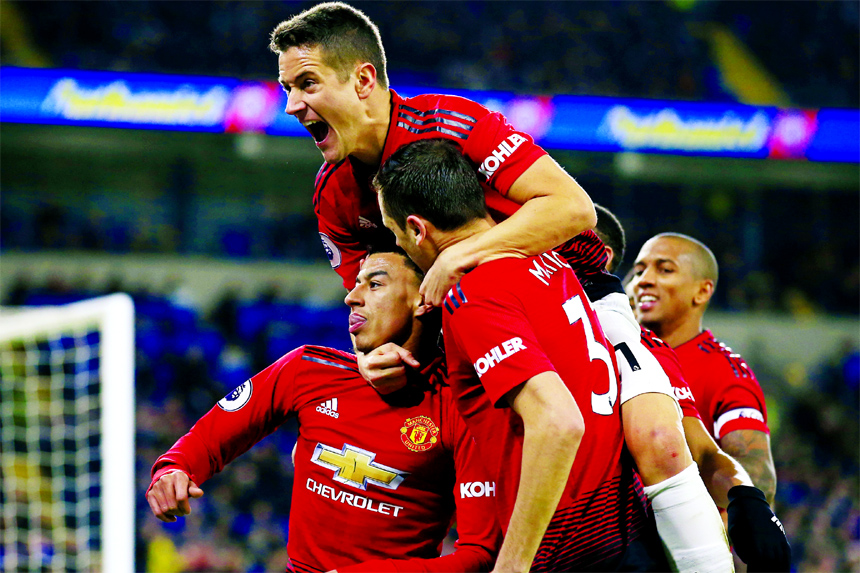 Manchester United midfielder Jesse Lingard, with his teammates celebrates his goal against Cardiff City during the English Premier League match between Cardiff City and Manchester United at the Cardiff City Stadium in Cardiff, Wales on Saturday.