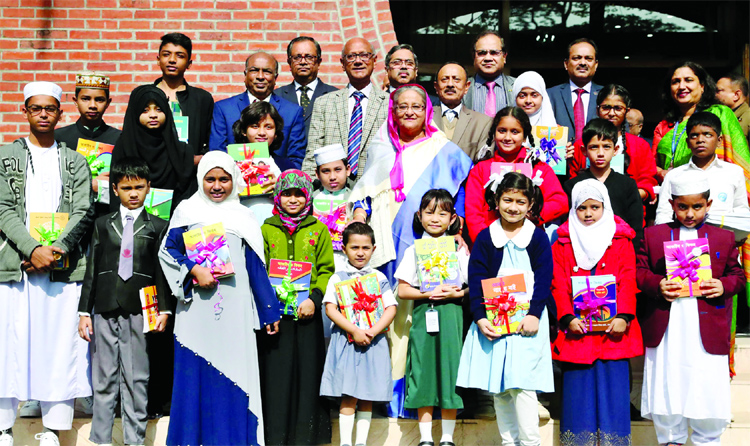 Prime Minister Sheikh Hasina among the students of different classes at the inaugural ceremony of book distribution free of cost at Ganobhaban on Monday.