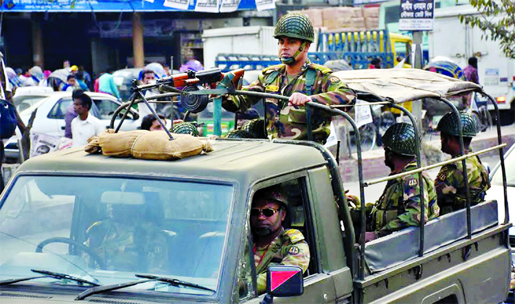 Members of Armed Forces patrolling on Bangabandhu Road in Narayanganj on Monday to maintain law and order situation ahead of next Parliamentary Election to be held on December 30.