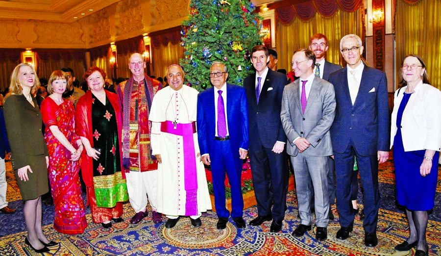 President Abdul Hamid poses for a photo session with diplomats after exchanging greetings with the people of Christian community on the occasion of holy Christmas at Bangabhaban on Tuesday. Press Wing, Bangabhaban photo