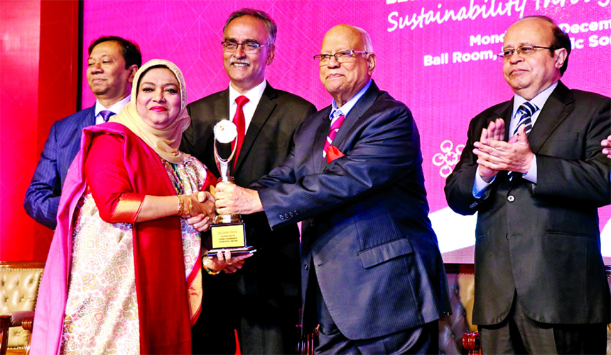 Mohammodi Khanam, Managing Director of Prime Insurance Company Limited, receiving the second best ICAB Award under insurance category from Finance Minister Abul Maal Abdul Muhith, at hotel in the city on Monday. Dewan Nurul Islam, President of ICAB and C