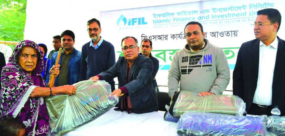 AZM Saleh, Managing Director of Islamic Finance and Investment Limited (IFIL), distributing blankets among the cold-hit people at Gazaria upazila of Munshiganj as its CSR activities on Saturday. SQ Bazlur Rashid, Secretary and senior officials of the comp