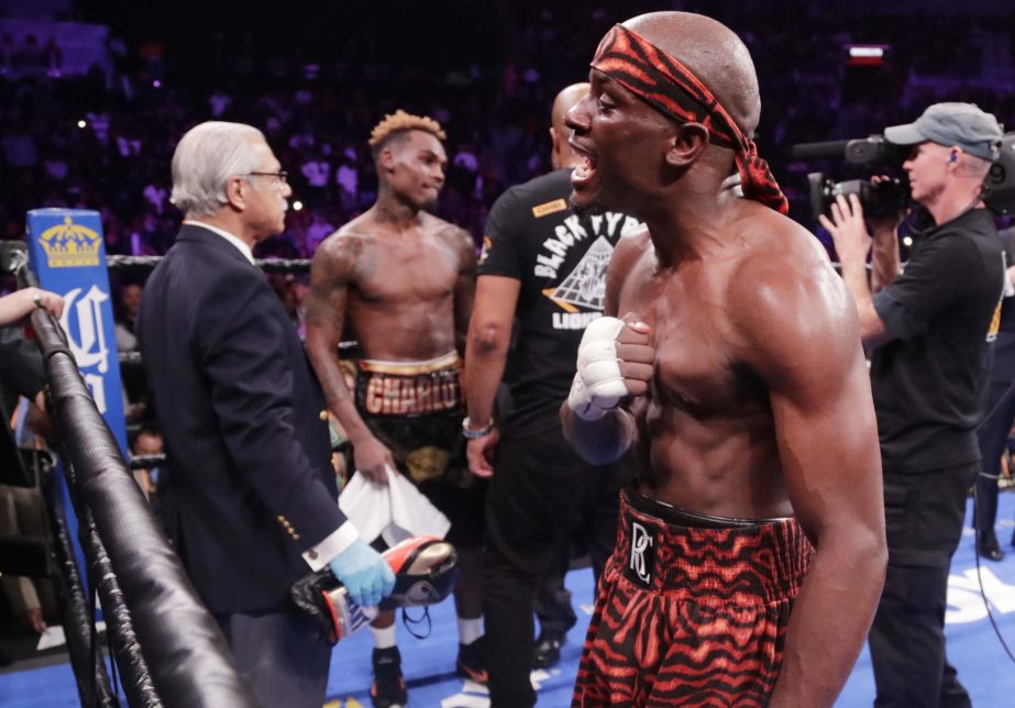 Tony Harrison (right) reacts after defeating Jermell Charlo in a WBC super welterweight championship boxing match in New York on Saturday