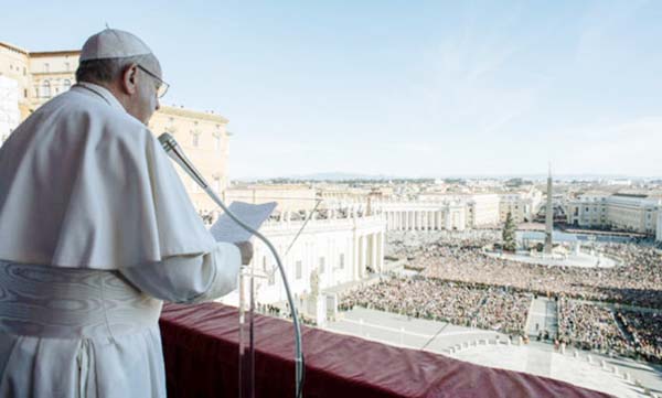 PIC: Pope Francis delivering the "Urbi et Orbi"" message from the balcony of St Peter's basilica on Tuesday."