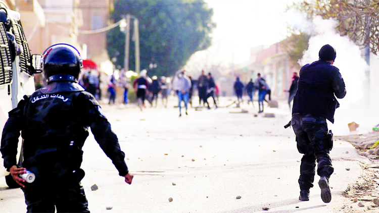 Police firing tear gas to disperse protesters who blocked the main street, set tyres ablaze and threw stones at police.