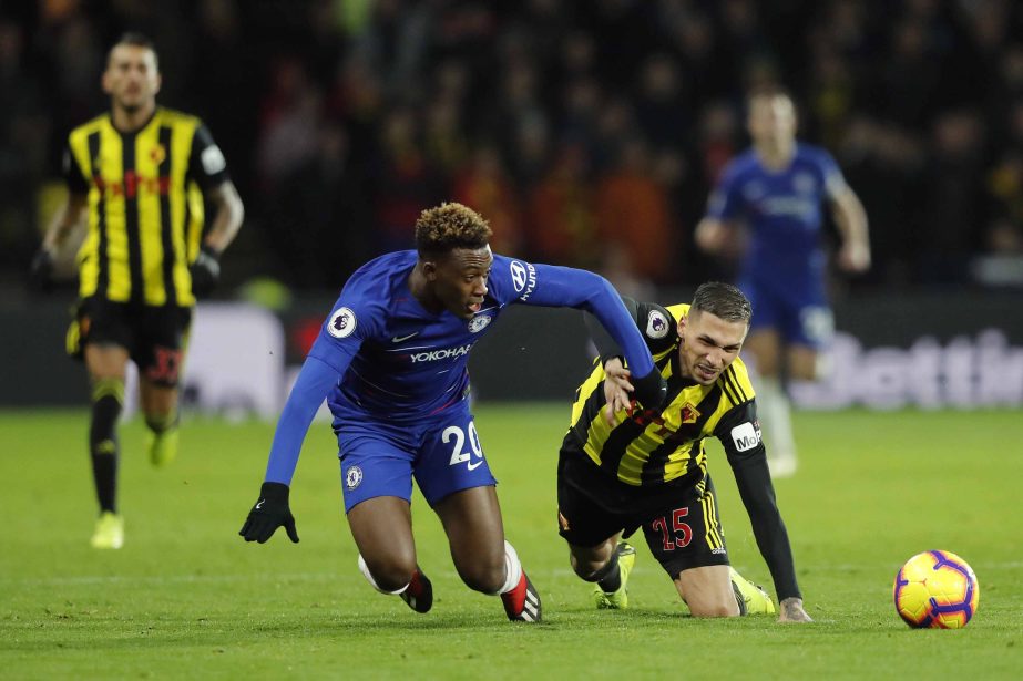 Chelsea's Callum Hudson-Odoi (left) and Watford's Jose Holebas challenge for the ball during the English Premier League soccer match between Watford and Chelsea at Vicarage Road stadium in Watford, England on Wednesday.