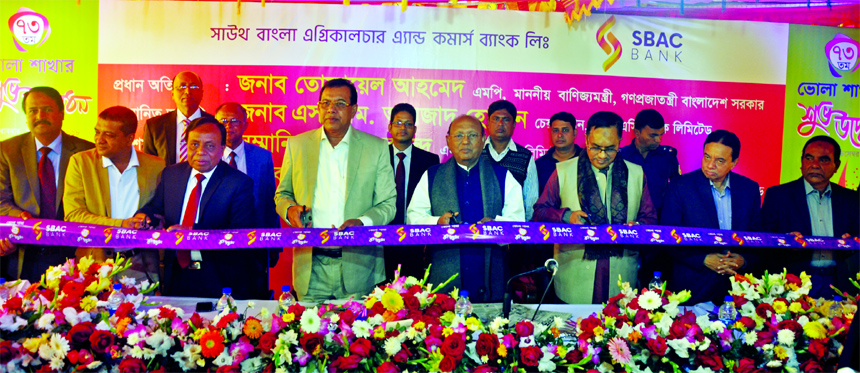 Commerce Minister Tofail Ahmed, inaugurating the 73rd branch of South Bangla Agriculture and Commerce (SBAC) Bank Limited, at Bhola Sadar recently. SM Amzad Hossain, Chairman, Md. Golam Faruque, Managing Director, other senior officials of the Bank and lo