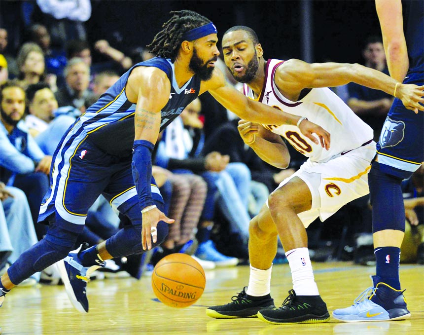 Memphis Grizzlies guard Mike Conley (left) drives against Cleveland Cavaliers guard Alec Burks during the second half of an NBA basketball game on Wednesday in Memphis, Tenn.