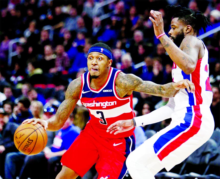 Washington Wizards guard Bradley Beal (3) drives against Detroit Pistons guard Reggie Bullock (25) during the second half of an NBA basketball game in Detroit on Wednesday. The Pistons defeated the Wizards 106-95.