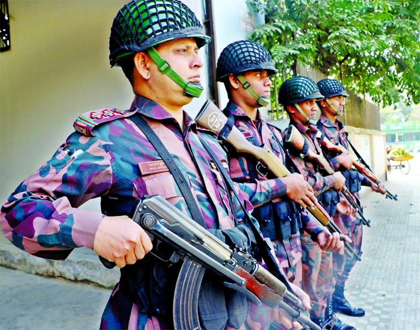 BGB members stand guard for security measures ahead of the 11th parliamentary elections. The snap was taken from in front of BG Press in the city's Tejgaon area on Friday.