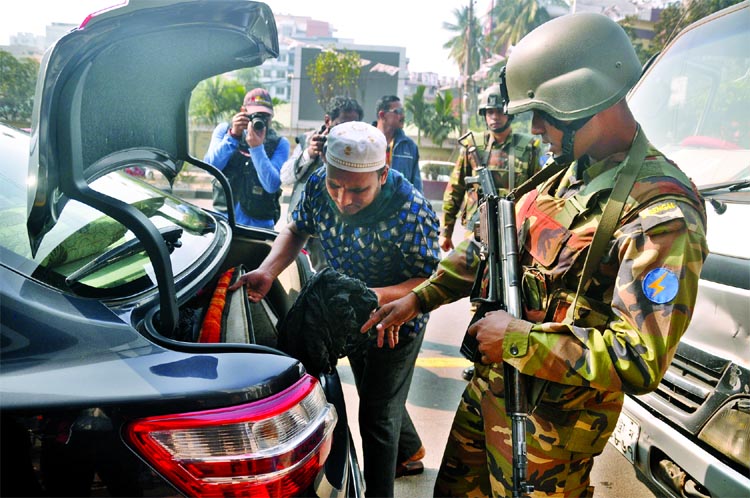 Members of Armed Forces conducting search at a vehicle to avoid any untoward situation ahead of next election. This picture was was taken from city's Banglamotor area on Friday.