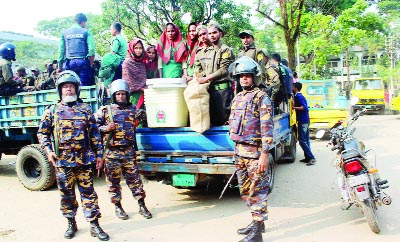 SYLHET: Members of Ansar- VDP members of Sylhet carrying election materials at Sylhet DC Office yesterday.