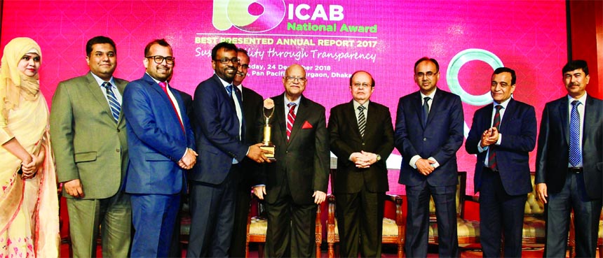 Mominul Islam, Managing Director of IPDC Finance Limited, receiving the 18th ICAB National Award from Finance Minister AMA Muhith, under the category Financial Services Sector for Best Presented Annual Report 2017 by Institute of Chartered Accountants of