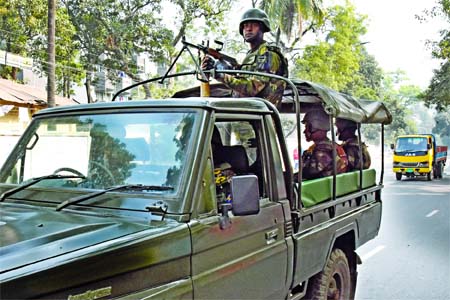 Armed Forces side by side with BGB, RAB, Police patrolling the street across the capital to maintain peace as 11th national polls today. This photo was taken from Dhaka University area on Saturday.