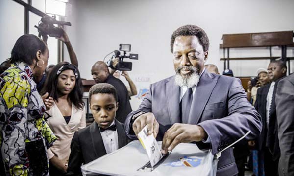 President Joseph Kabila cast his vote along with his family at the Insititut de la Gombe polling station in Kinshasa on Sunday.