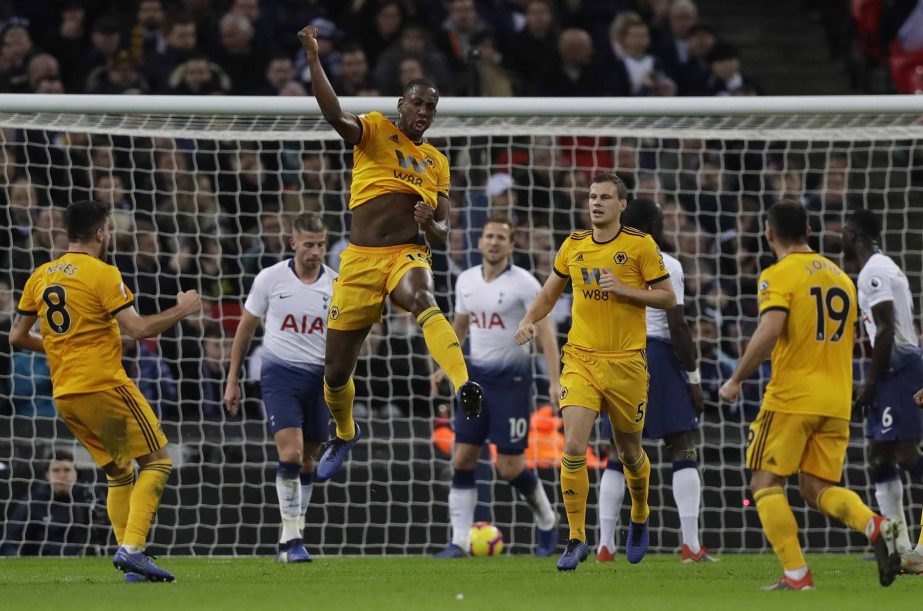 Wolverhampton Wanderers Willy Boly leaps up as he celebrates scoring his sides 1st goal during their English Premier League soccer match between Tottenham Hotspur and Wolverhampton Wanderers at Wembley stadium in London on Saturday.