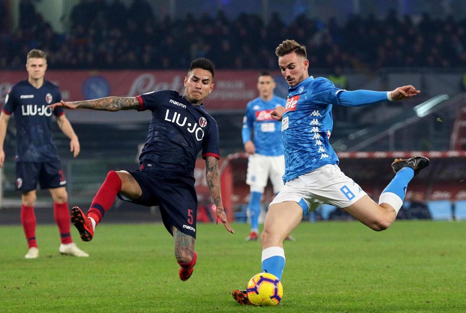 Bologna midfielder Erick Pulgar (left) and Napoli's midfielder Fabian Ruiz compete for the ball during a Serie A soccer match between Napoli and Bologna at the San Paolo stadium in Naples, Italy on Saturday.