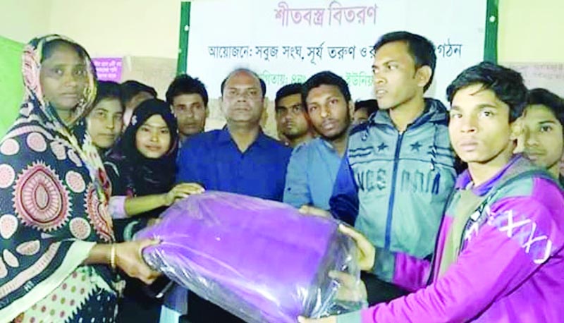 GANGACHARA (Rangpur): Al Sumon Abdullah, Chairman, Gangachara Upazila distributing blankets among the cold -hit people jointly organised by youth organisations Sobuj Sangho, Surjo Torun and Rangdhonu recently.