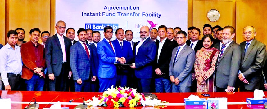 Md. Arfan Ali, Managing Director of Bank Asia Limited and Kamal Quadir, CEO of bKash, recently exchanging an agreement signing document at the Bank's corporate office in the city. Under the deal, customers of the Bank will be able to transfer their funds