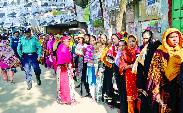 Female voters in long queue in city's Lalbagh Government Model School and College on Sunday.