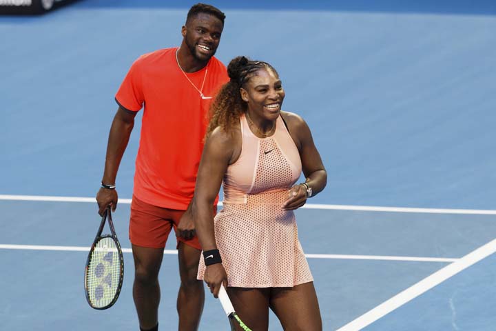 Serena Williams and Frances Tiafoe of the United States smile during their mixed doubles match against Stefanos Tsitsipass and Maria Sakkari of Greece at the Hopman Cup in Perth, Australia on Monday.