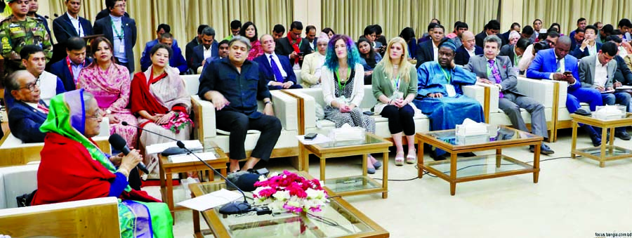 AL President and Prime Minister Sheikh Hasina exchanging views with the visiting delegation of election observers at Ganobhaban on Monday. BSS photo