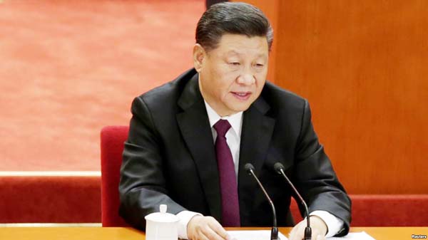 Chinese President Xi Jinping prepares to leave at the end of an event marking the 40th anniversary of China's reform and opening up at the Great Hall of the People in Beijing.